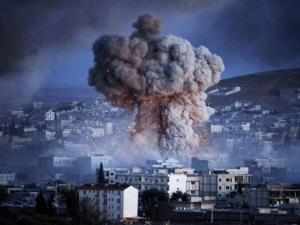 Airstrike-independent.co.uk An explosion rocks Syrian city of Kobani Getty